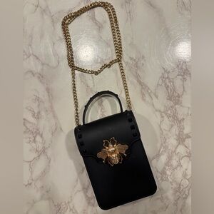 Black crossbody bag with gold bee and chain jelly bag